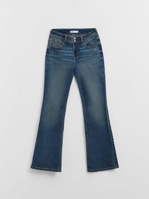 Blue flared jeans with decorative pockets