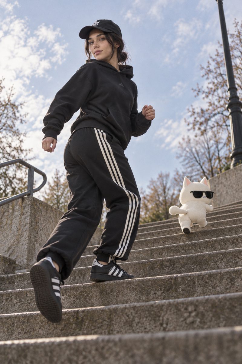 Hoodie, track pants, baseball cap and sneakers, worn by Kate
